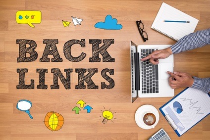 Businessman working at office desk and using computer and objects on the right, coffee, top view, Backlinks Technology